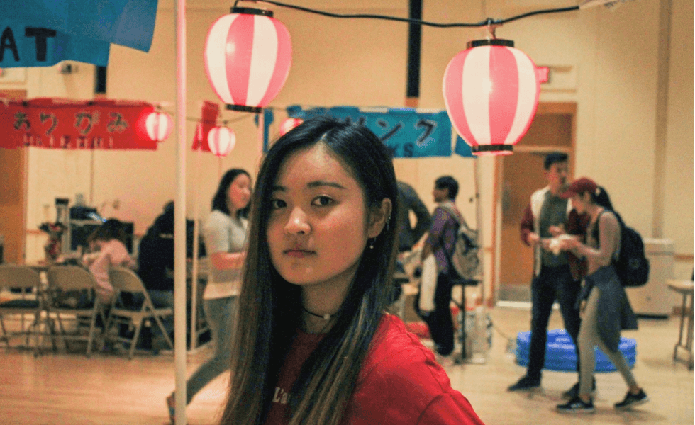 Woman with booths in background